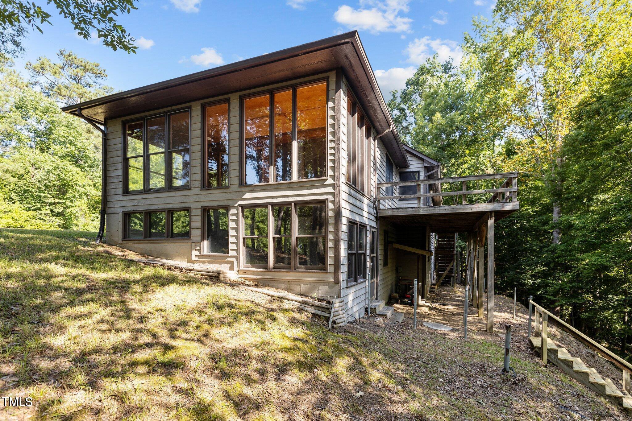 5900 Ebenezer Church Road Raleigh, NC 27612 - Photo 1 of 71 a front view of a house with garden