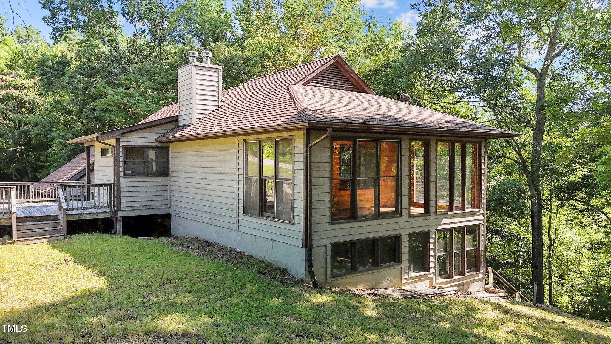 5900 Ebenezer Church Road Raleigh, NC 27612 - Photo 11 of 71 a front view of a house with a yard