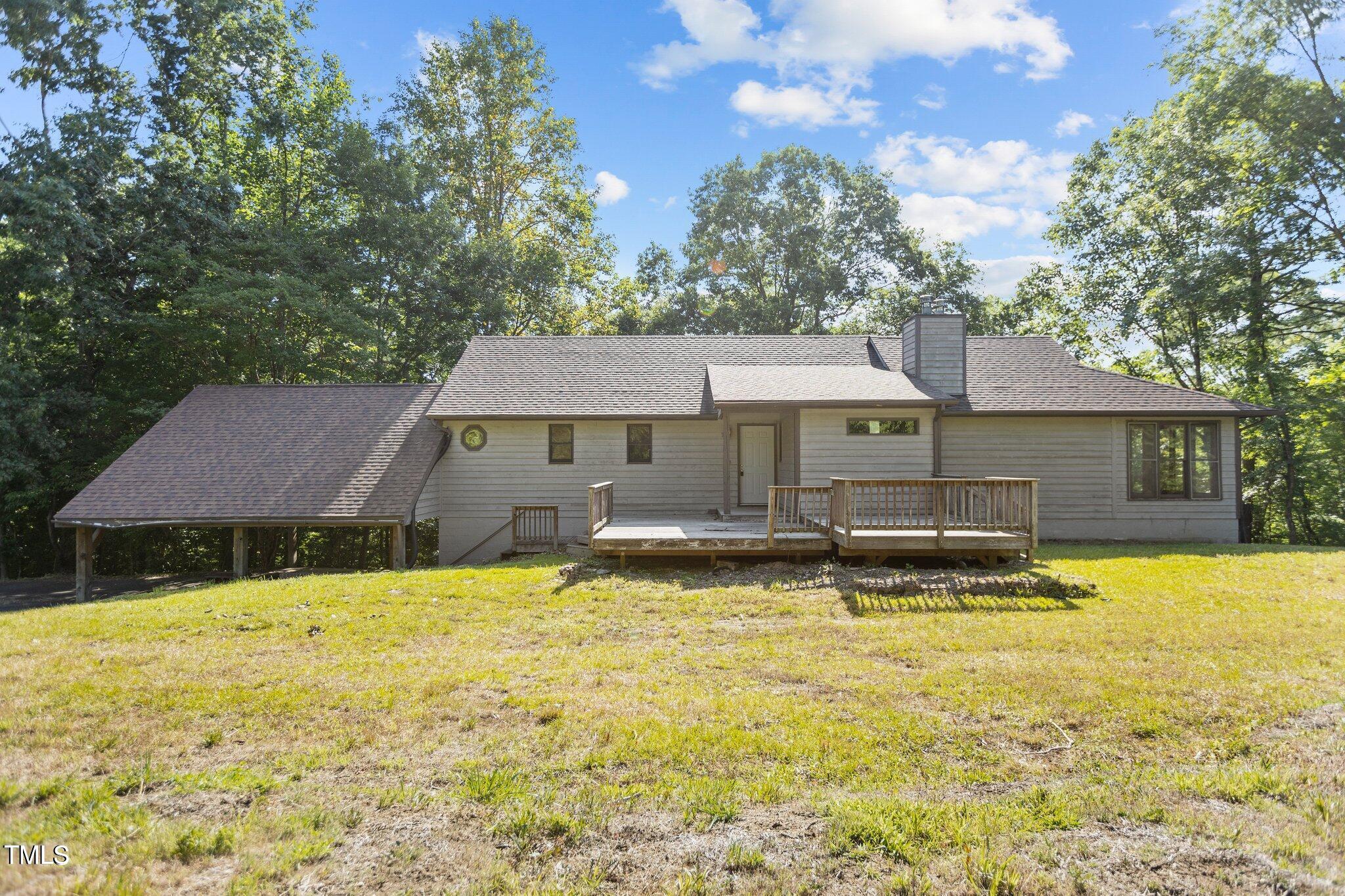 5900 Ebenezer Church Road Raleigh, NC 27612 - Photo 12 of 71 a front view of a house with swimming pool