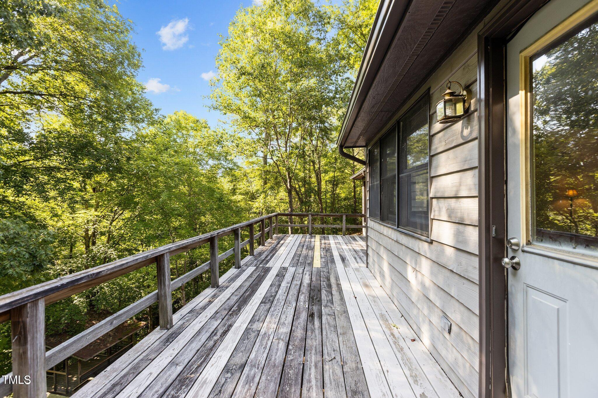 5900 Ebenezer Church Road Raleigh, NC 27612 - Photo 15 of 71 a view of balcony with wooden floor