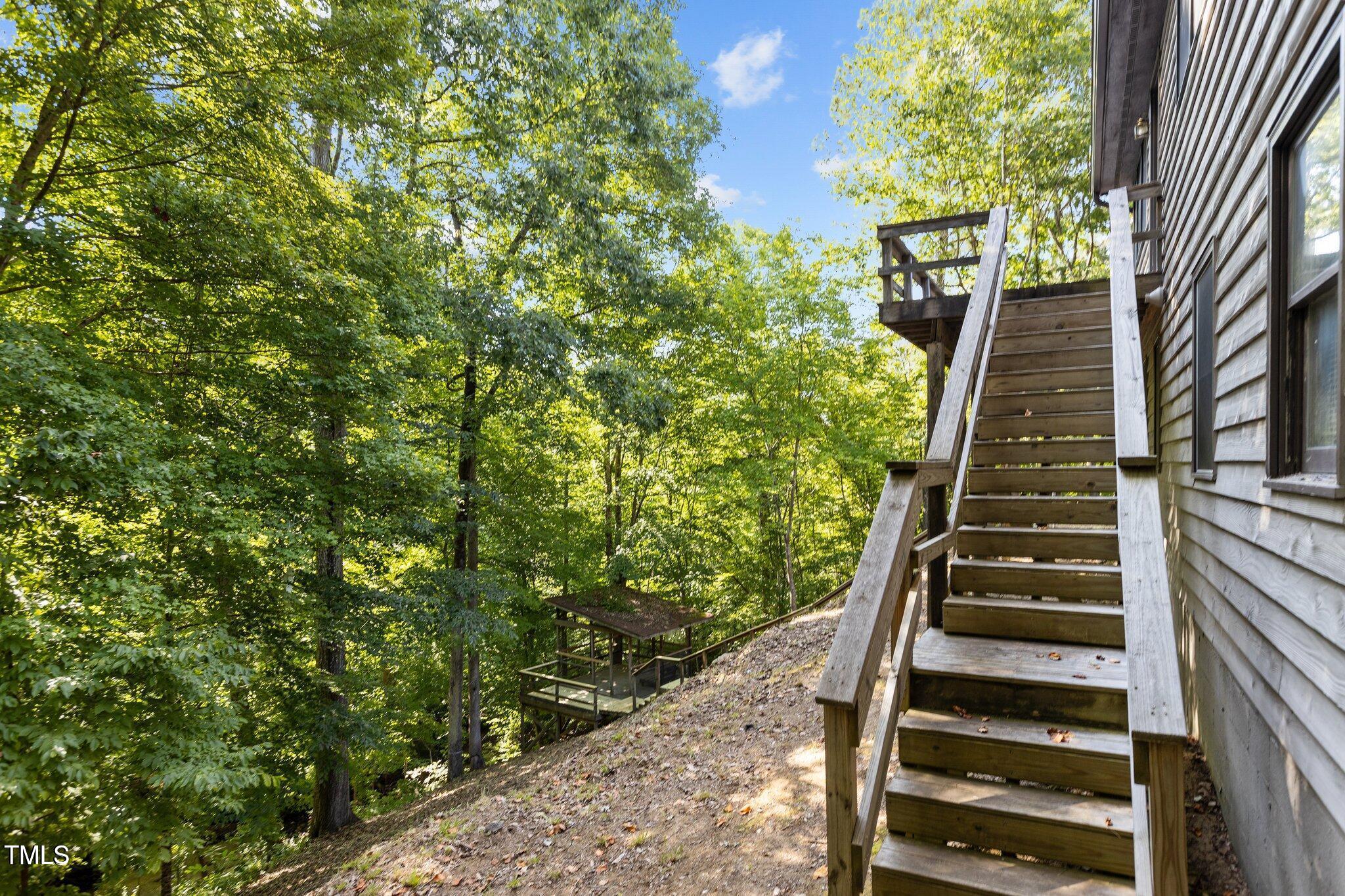 5900 Ebenezer Church Road Raleigh, NC 27612 - Photo 16 of 71 a view of stairs with wooden floor