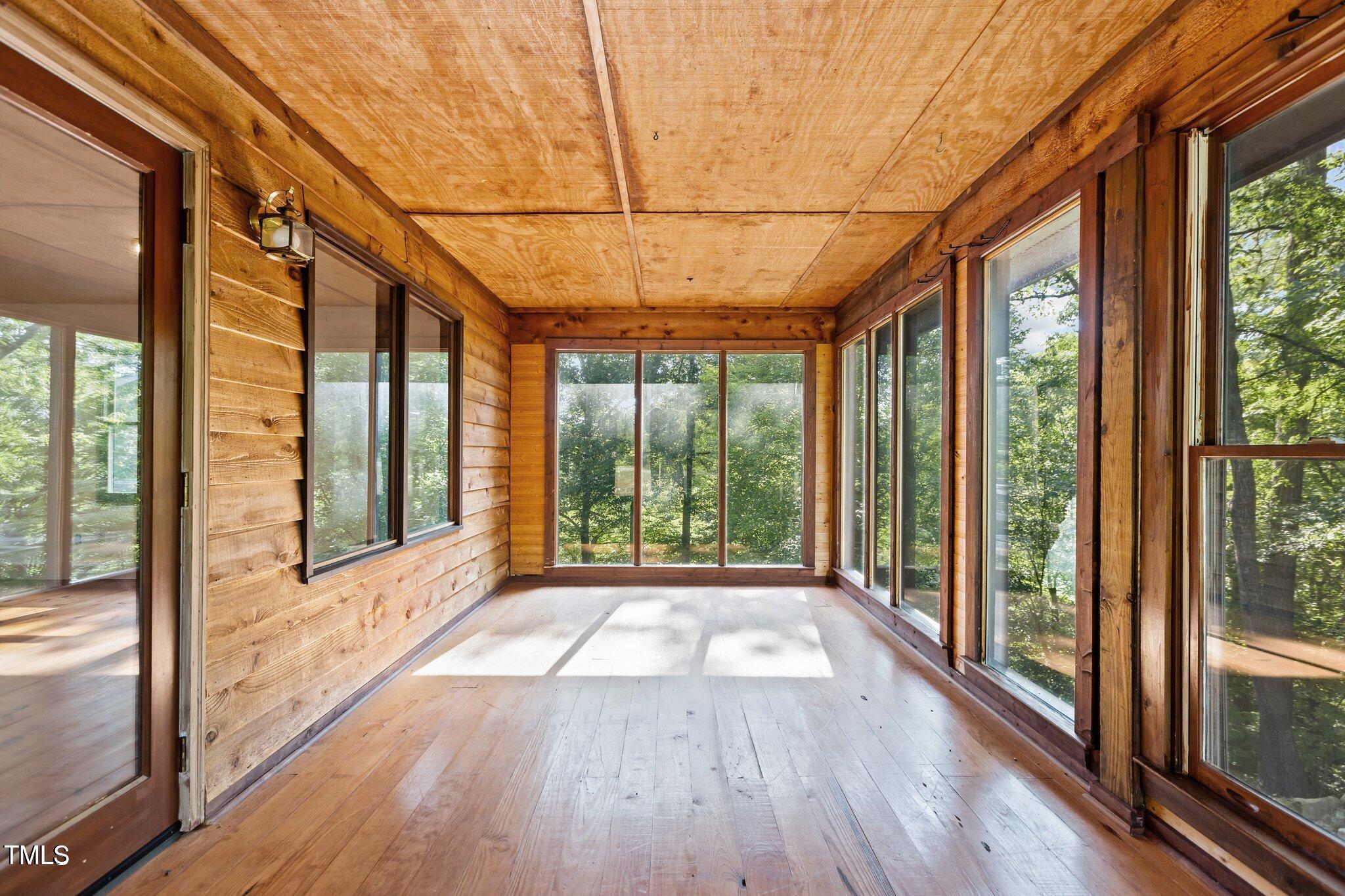 5900 Ebenezer Church Road Raleigh, NC 27612 - Photo 23 of 71 a view of big room with wooden floor and windows