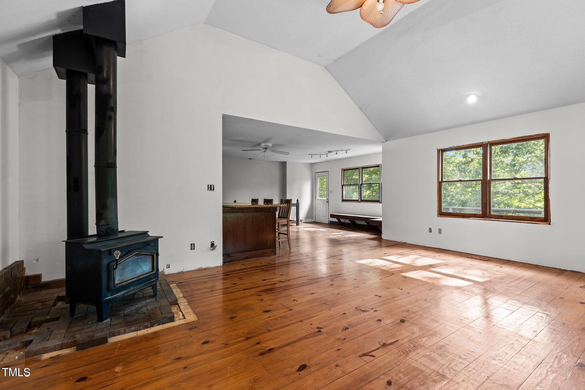 5900 Ebenezer Church Road Raleigh, NC 27612 - Photo 24 of 71 a view of an empty room with window and hardwood floor