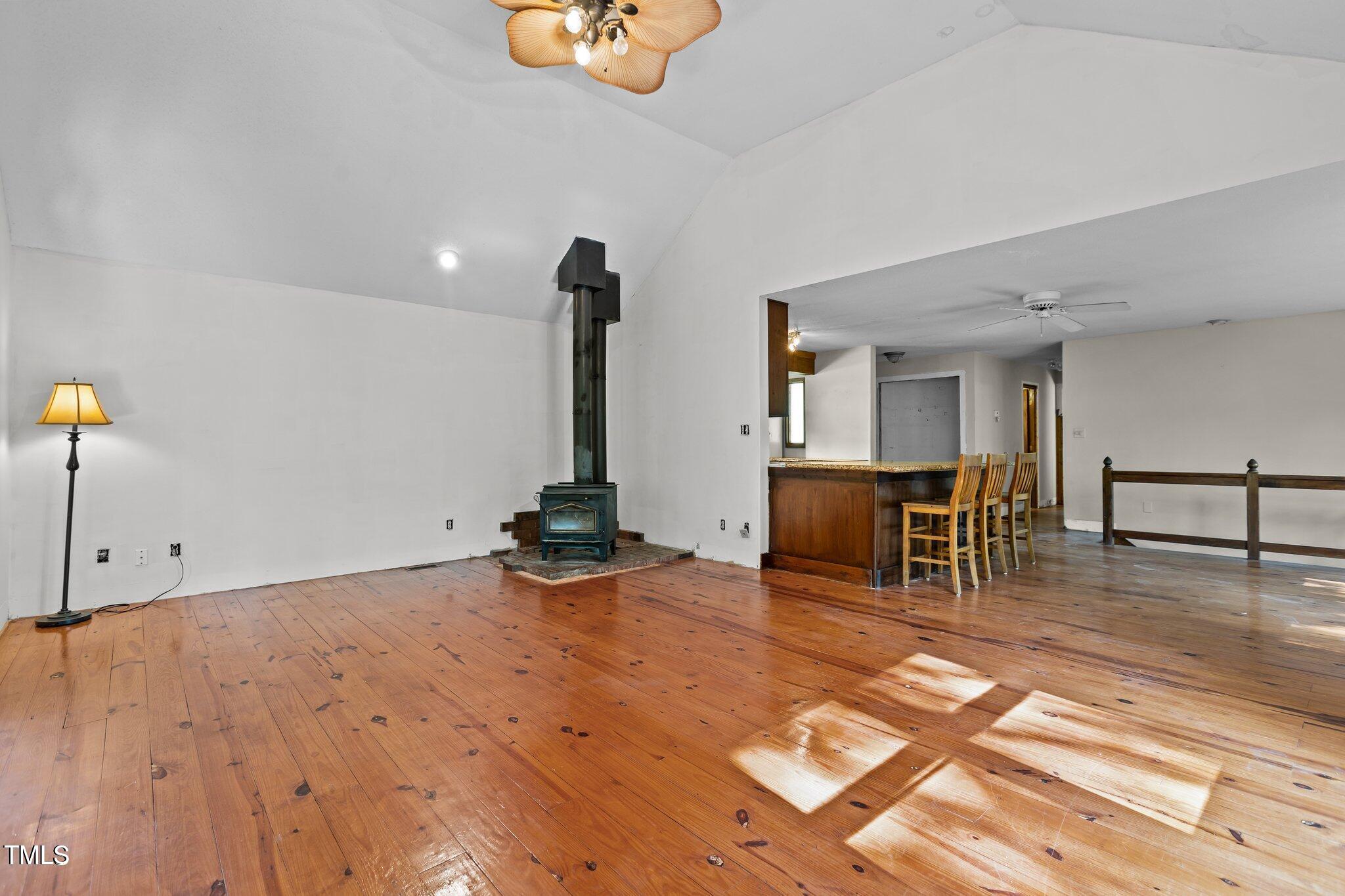 5900 Ebenezer Church Road Raleigh, NC 27612 - Photo 25 of 71 a view of a room with gym equipment and wooden floor