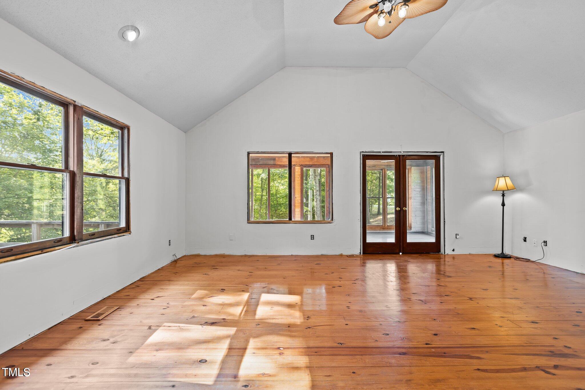 5900 Ebenezer Church Road Raleigh, NC 27612 - Photo 26 of 71 a view of an empty room with window and wooden floor