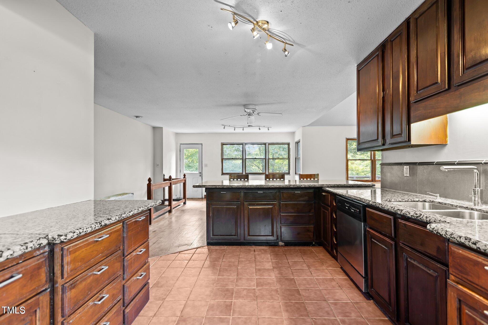 5900 Ebenezer Church Road Raleigh, NC 27612 - Photo 27 of 71 a large kitchen with granite countertop lots of counter space and sink