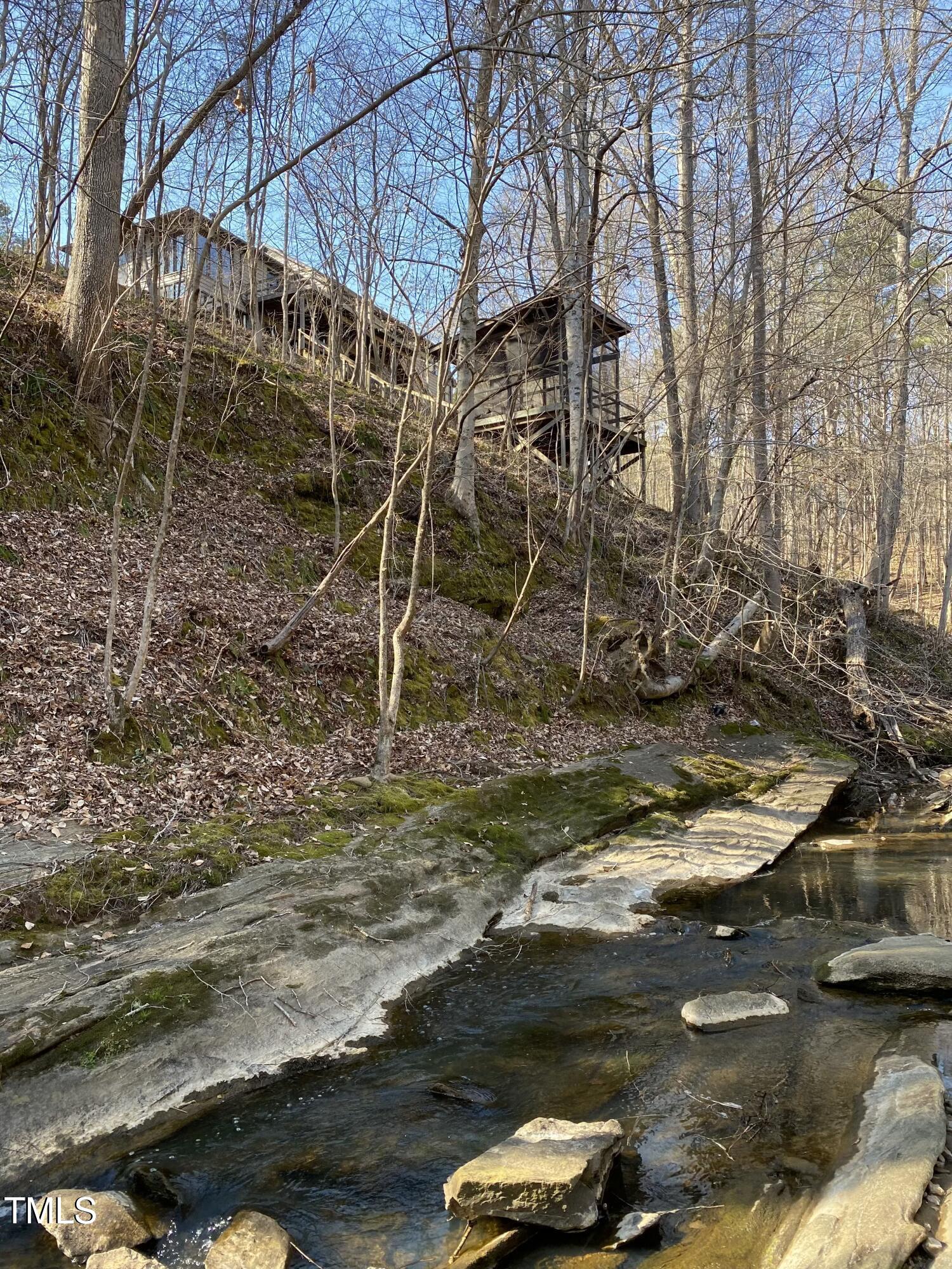 5900 Ebenezer Church Road Raleigh, NC 27612 - Photo 2 of 71 a view of swimming pool with lawn chairs and wooden fence