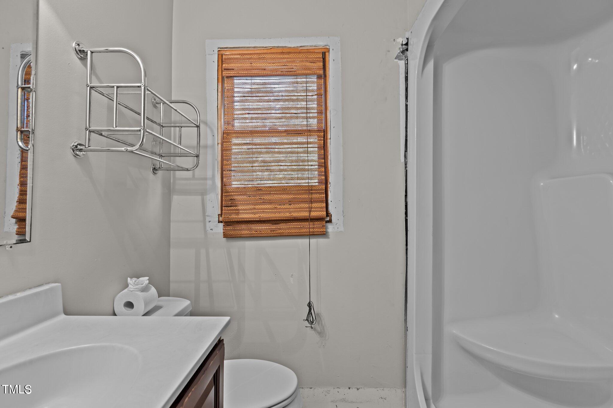 5900 Ebenezer Church Road Raleigh, NC 27612 - Photo 40 of 71 a bathroom with a sink toilet and shower
