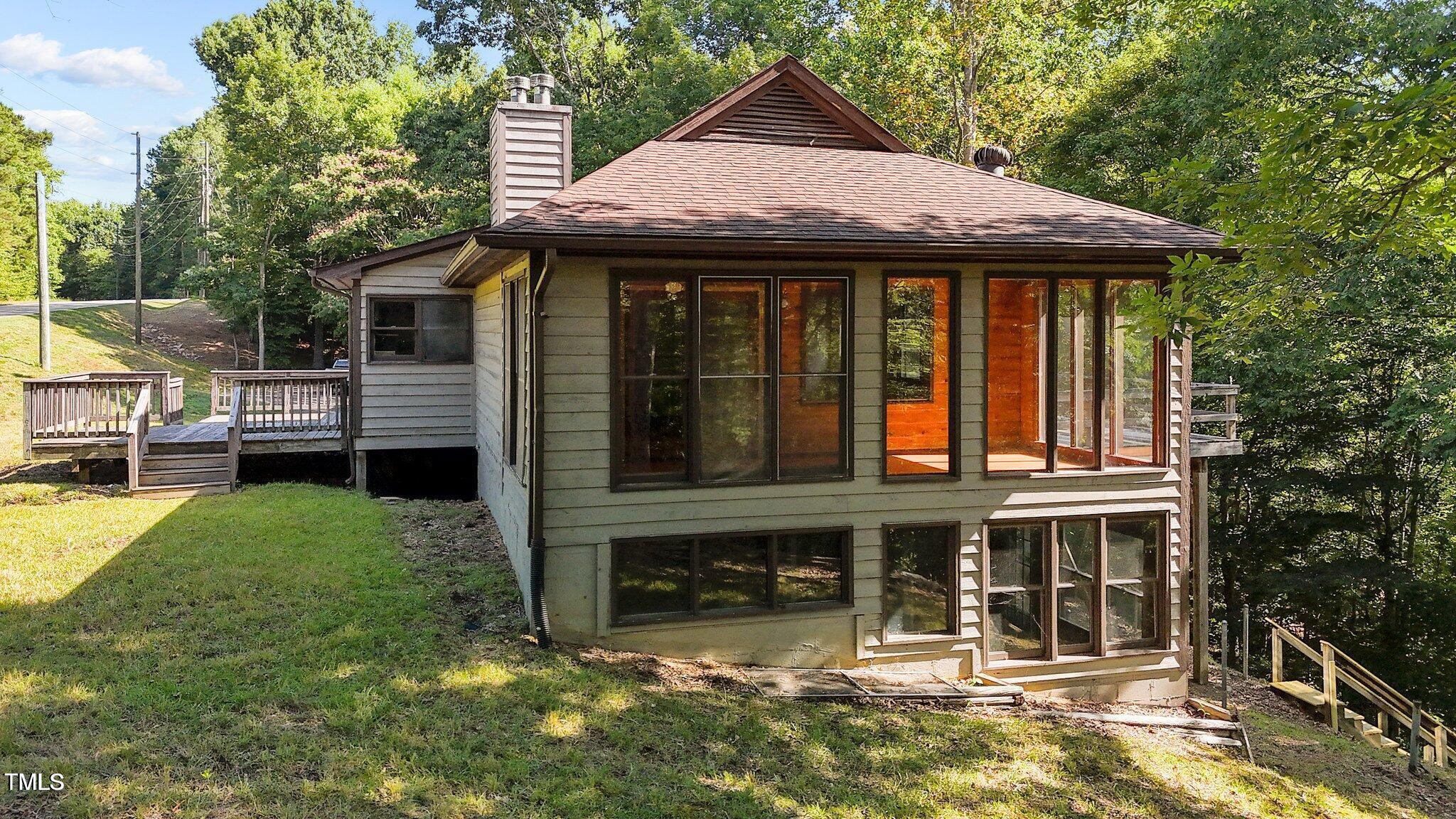 5900 Ebenezer Church Road Raleigh, NC 27612 - Photo 3 of 71 a front view of a house with garden