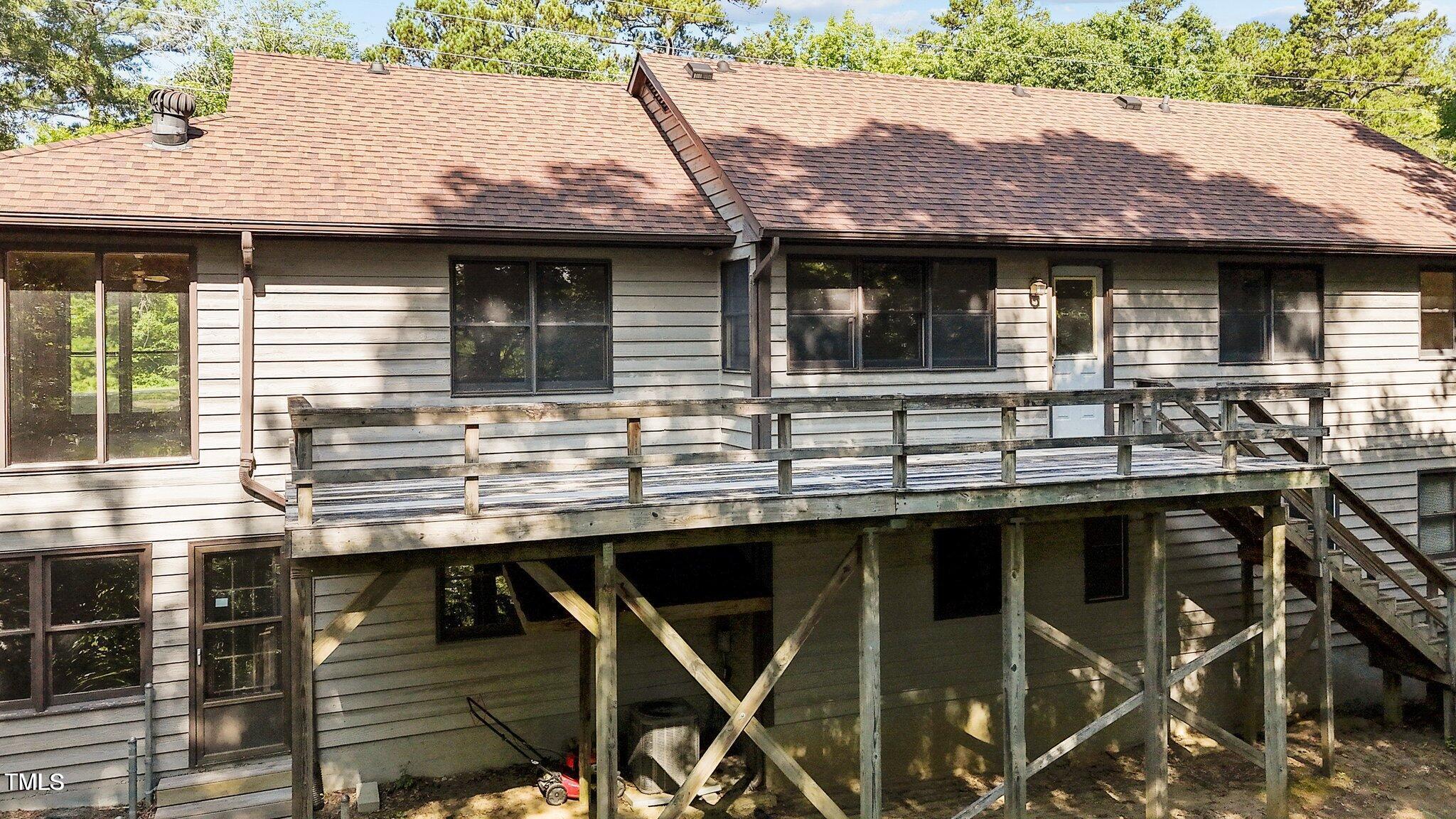 5900 Ebenezer Church Road Raleigh, NC 27612 - Photo 49 of 71 a view of a house with a balcony and wooden floor