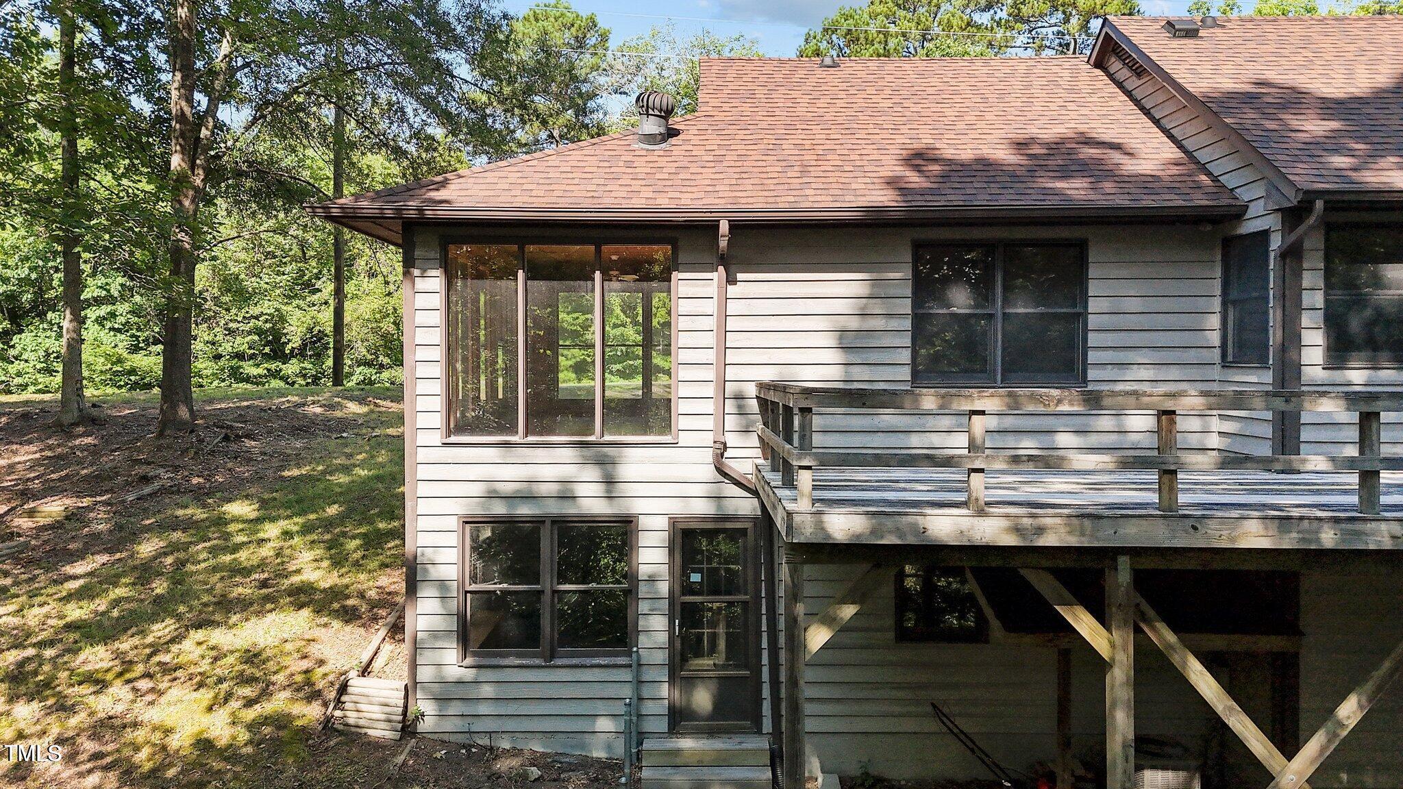 5900 Ebenezer Church Road Raleigh, NC 27612 - Photo 50 of 71 a view of a house with porch and wooden floor
