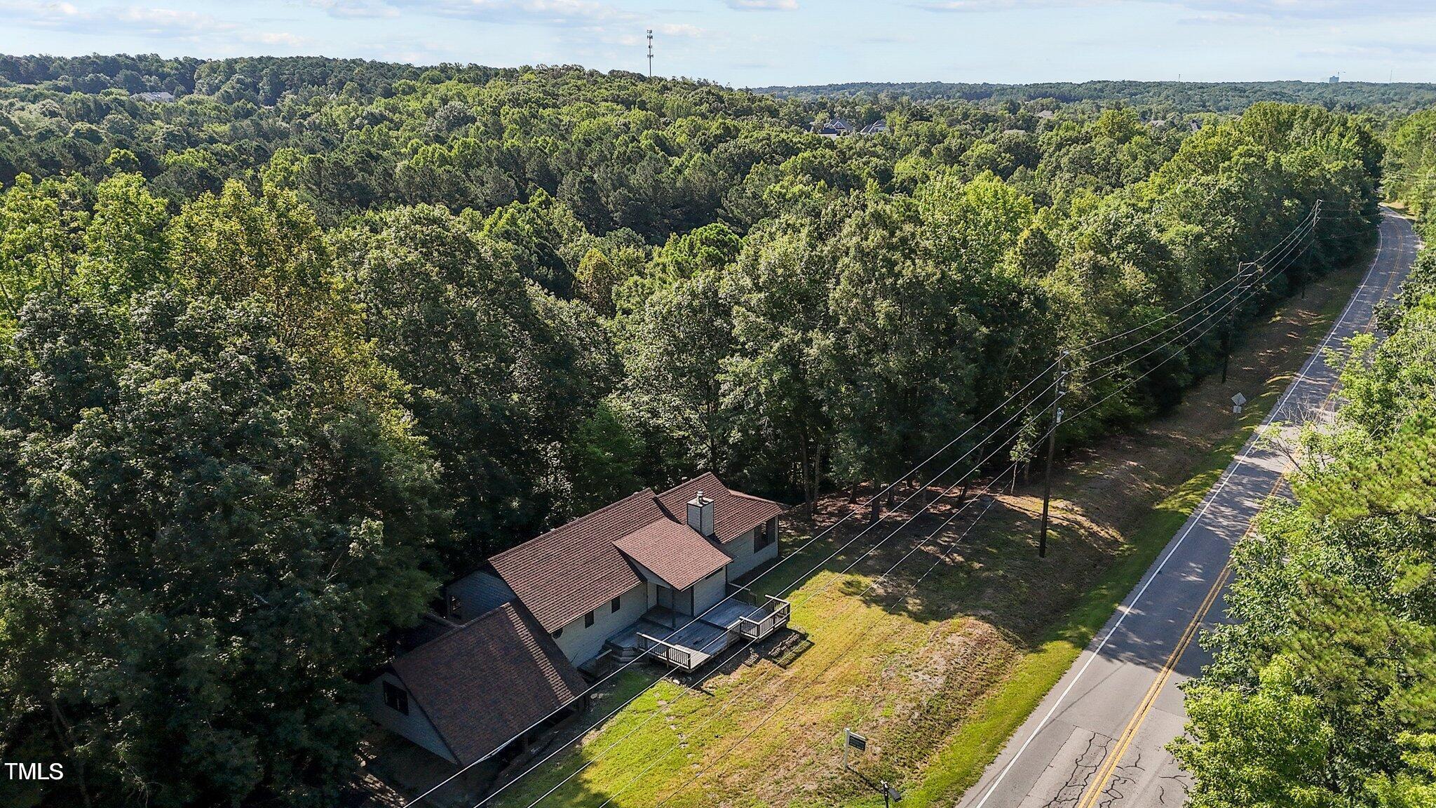 5900 Ebenezer Church Road Raleigh, NC 27612 - Photo 53 of 71 an aerial view of a house with a yard