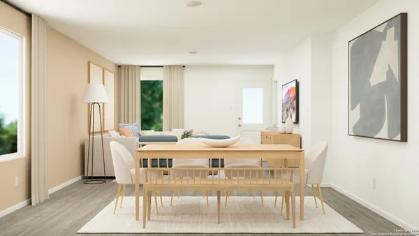 a view of a living room with furniture and a window