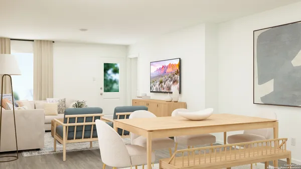 a living room with furniture and a table