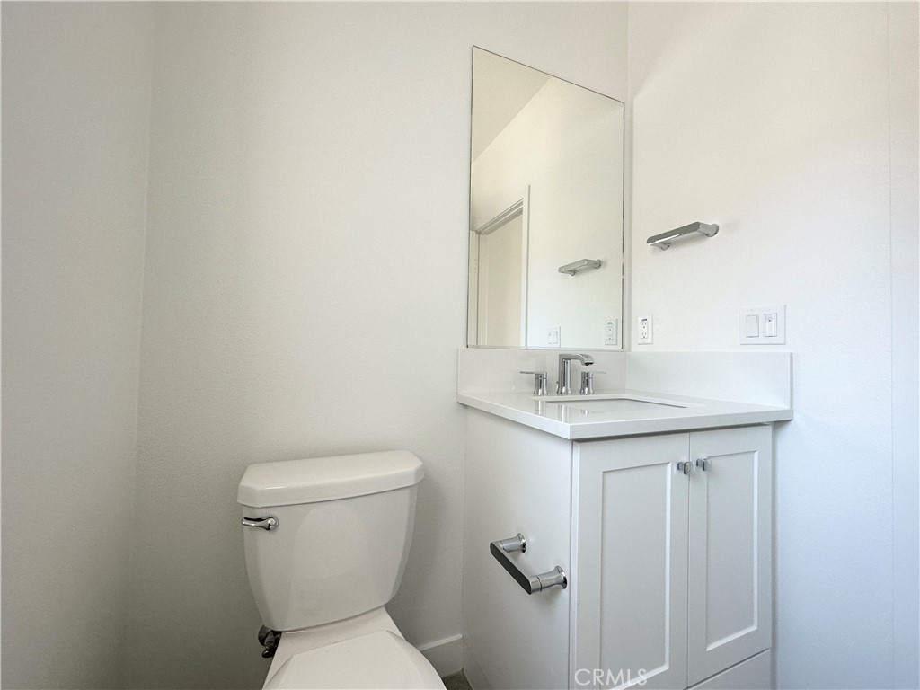 322 Tank Irvine, CA 92618 - Photo 16 of 43 a bathroom with a sink toilet and a mirror