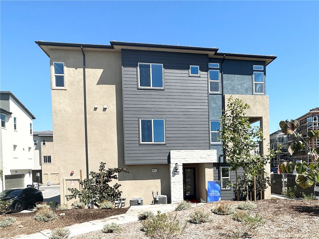 322 Tank Irvine, CA 92618 - Photo 2 of 43 a front view of a house with a yard