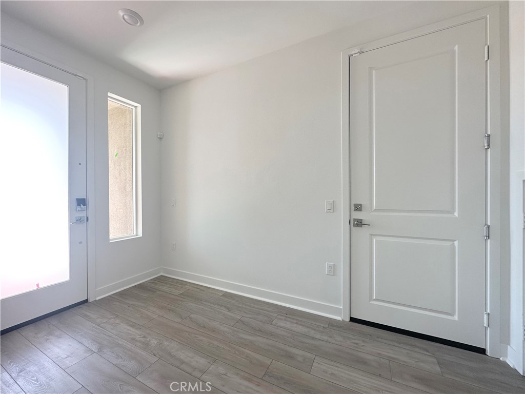 322 Tank Irvine, CA 92618 - Photo 3 of 43 a view of an empty room with wooden floor