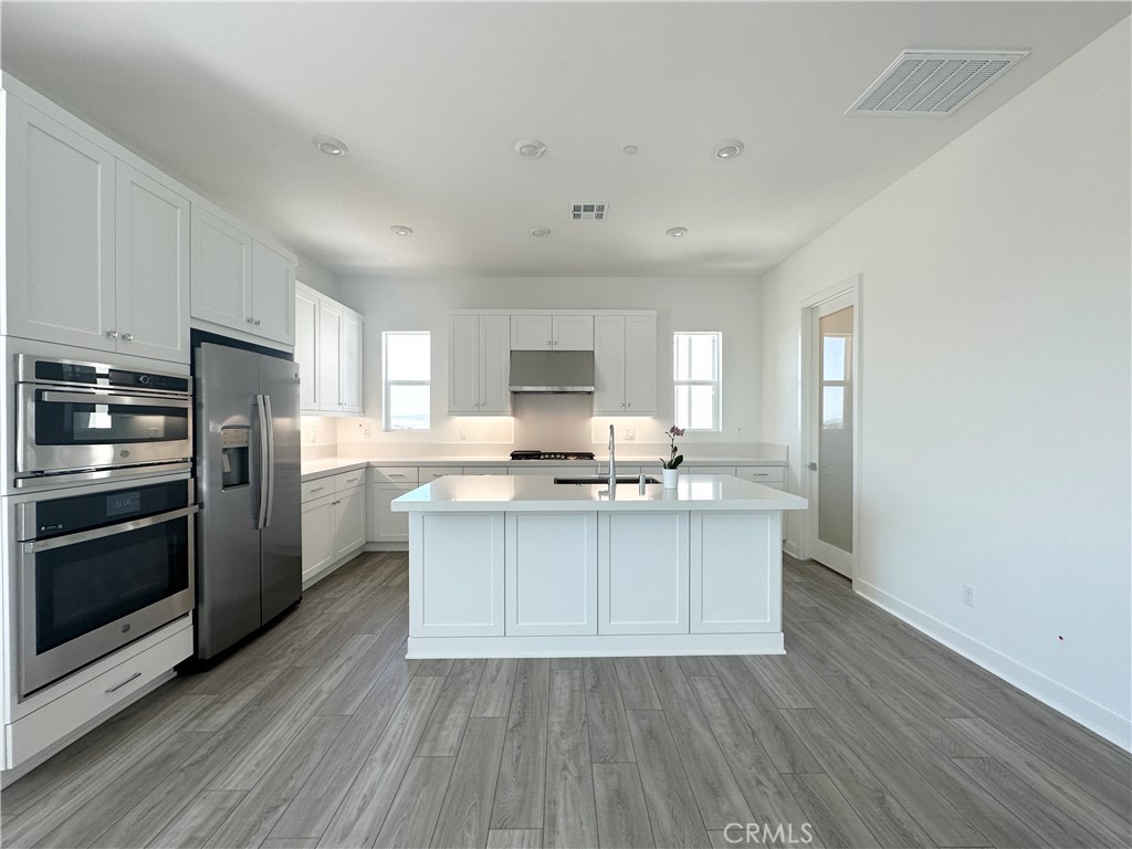 322 Tank Irvine, CA 92618 - Photo 9 of 43 a kitchen with stainless steel appliances a sink stove and refrigerator