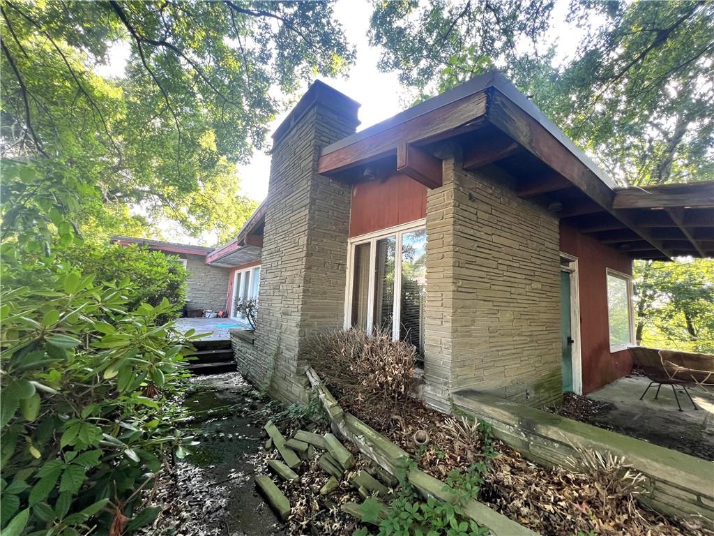 1560 Oneida Drive Clairton, PA 15025 - Photo 6 of 17 a front view of a house with garden