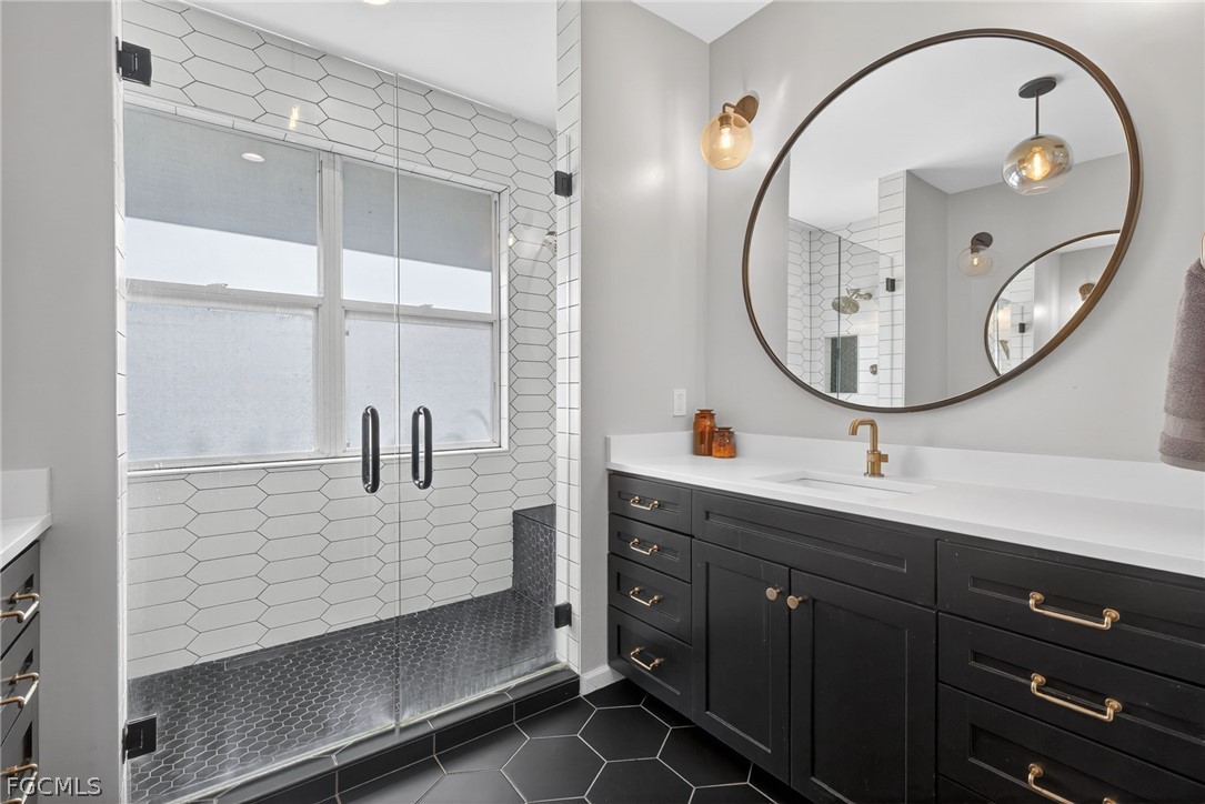 22866 Forest Ridge Drive Estero, FL 33928 - Photo 21 of 38 a bathroom with a sink and a mirror