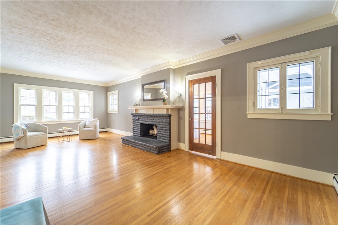 101 Thackery Road Brighton, NY 14610 - Photo 13 of 45 A grand living room with wood-burning fireplace an