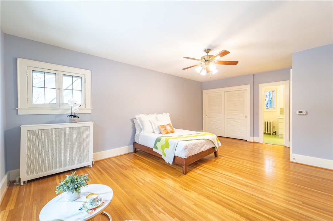 101 Thackery Road Brighton, NY 14610 - Photo 22 of 45 The spacious primary suite boasts leaded glass win