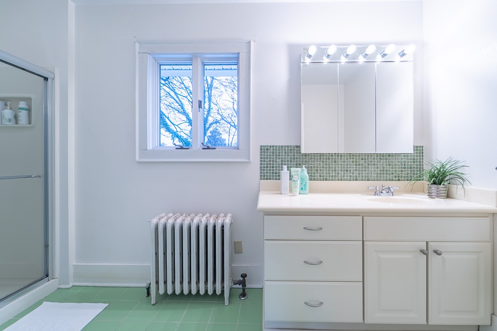 101 Thackery Road Brighton, NY 14610 - Photo 25 of 45 A walk-in glass shower and large vanity complete t