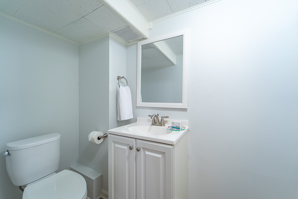 101 Thackery Road Brighton, NY 14610 - Photo 42 of 45 Half bathroom and laundry finish the lower level.