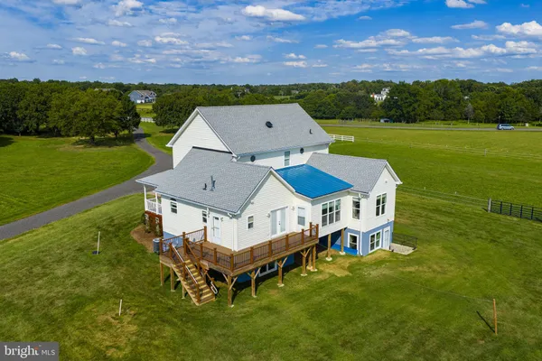 an aerial view of a house with a garden