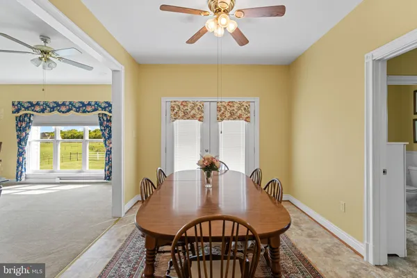 a dining room with furniture and window