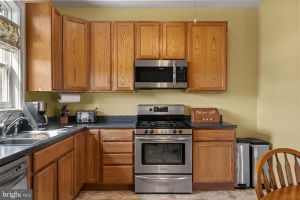 a kitchen with a stove and a sink