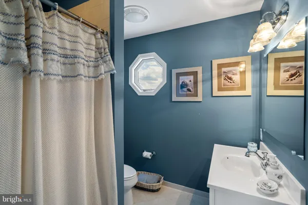 a bathroom with a toilet and a sink