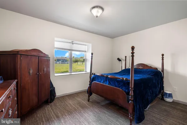 a bed room with a bed and a window