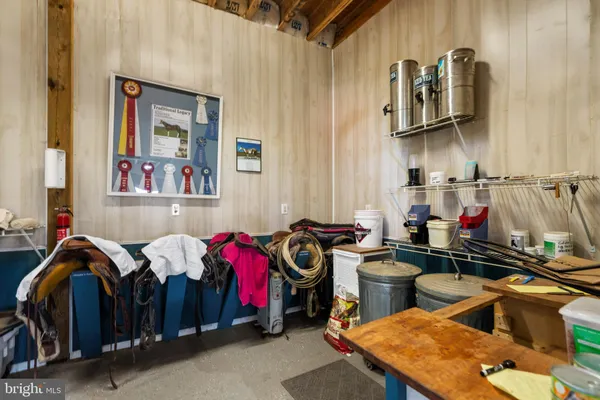a kitchen with a refrigerator and a stove top oven
