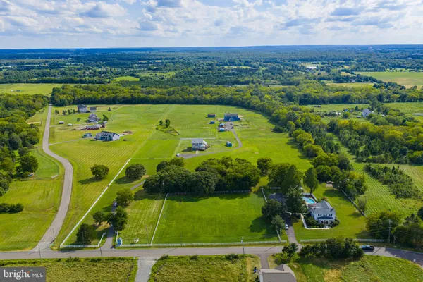 an aerial view of a golf course with a swimming pool