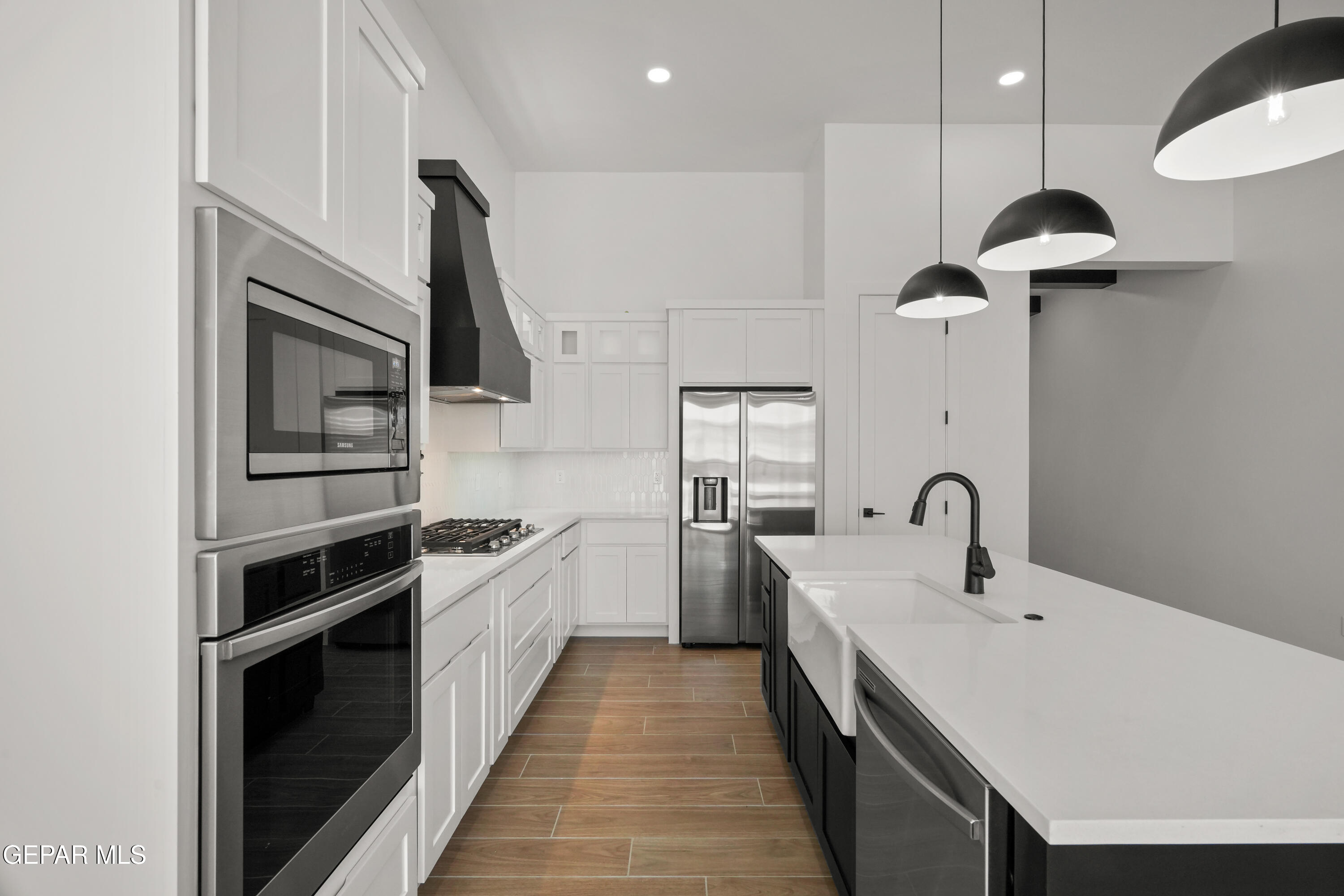 15225 Expectation El Paso, TX 79938 - Photo 16 of 38 a kitchen with a sink stainless steel appliances and cabinets