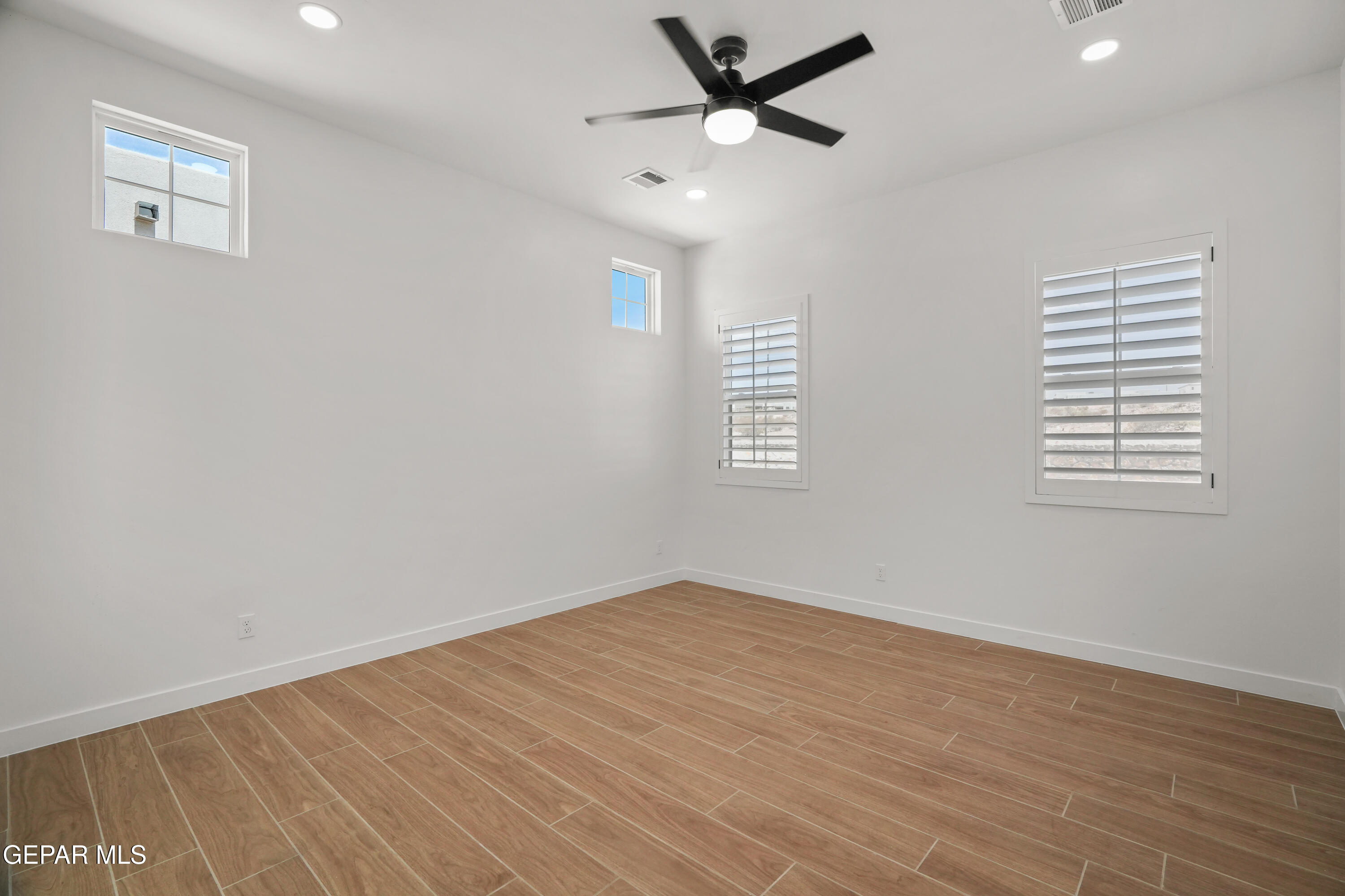 15225 Expectation El Paso, TX 79938 - Photo 26 of 38 wooden floor in an empty room with a window