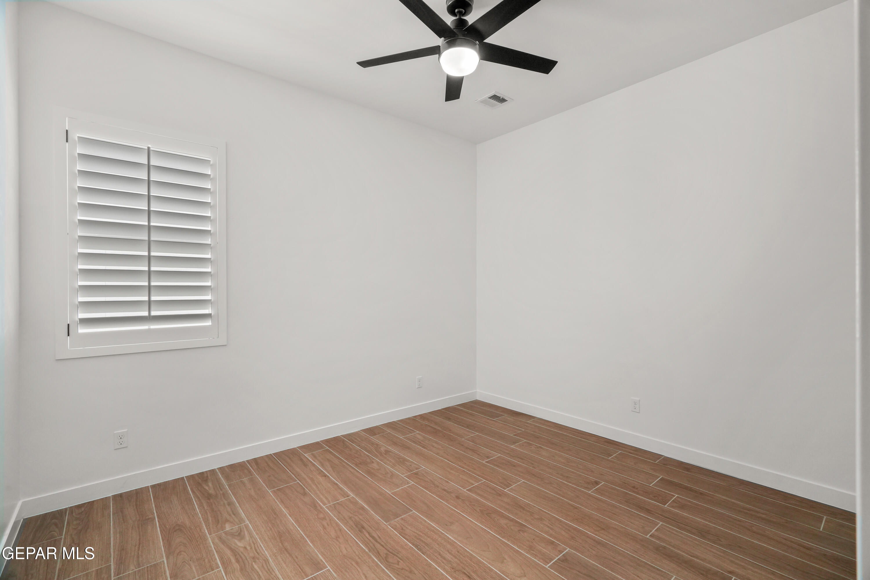 15225 Expectation El Paso, TX 79938 - Photo 37 of 38 a view of a room with wooden floor and a window