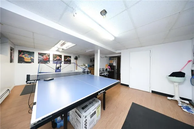 a view of a room with shelves and wooden floor
