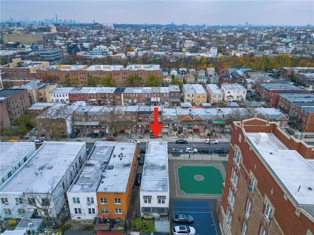 an aerial view of a city with a lake