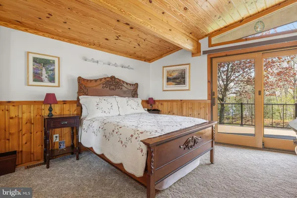 a bedroom with bed and window