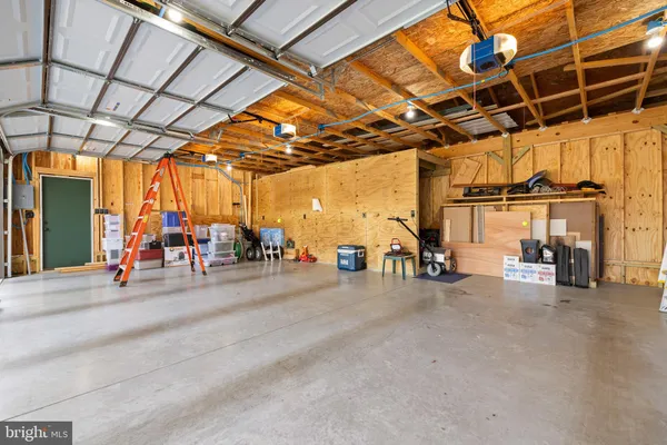 a view of a garage with a table and chairs