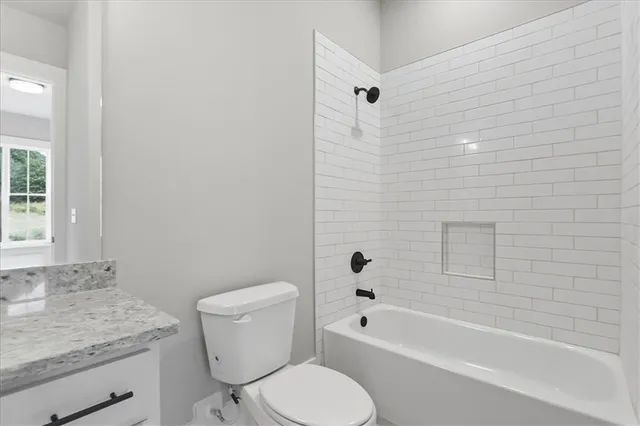 a view of an empty room and entryway