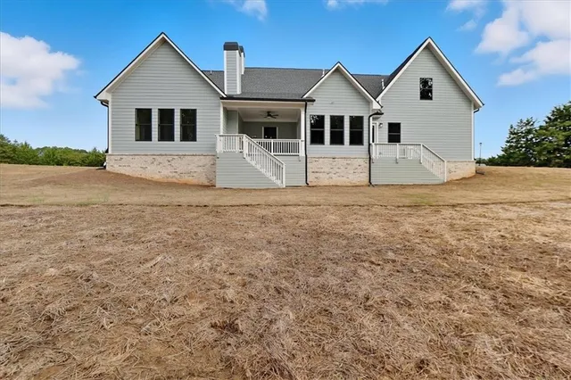 a view of a swimming pool with a yard