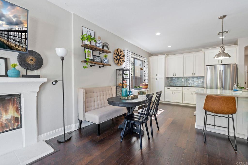 3880 Stoneridge Road Carlsbad, CA 92010 - Photo 13 of 29 a view of kitchen with dining area and wooden floor