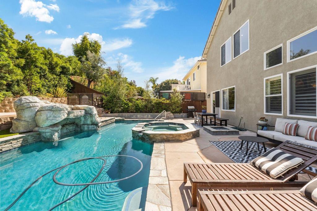 3880 Stoneridge Road Carlsbad, CA 92010 - Photo 20 of 29 a view of a patio with couches chair and potted plants