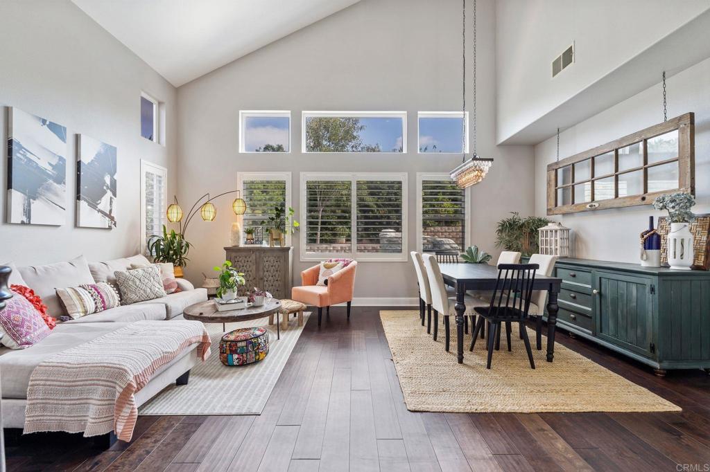 3880 Stoneridge Road Carlsbad, CA 92010 - Photo 5 of 29 a living room with furniture a dining table with wooden floor