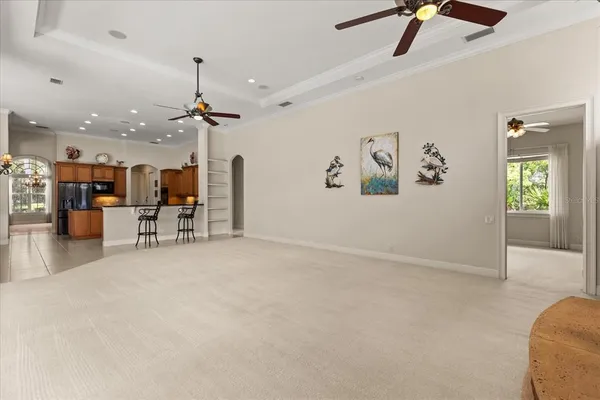 a view of a livingroom with furniture and a ceiling fan