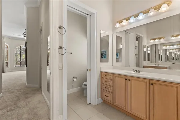 a bathroom with a sink a vanity and a mirror