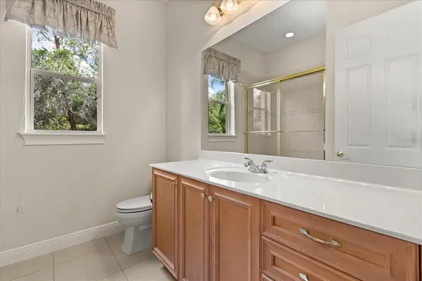 a bathroom with a glass shower door